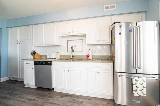 5800 N Ocean Blvd Unit 705, North Myrtle Beach, SC 29582 - kitchen featuring appliances with stainless steel finishes, dark wood-style flooring, and white cabinets
