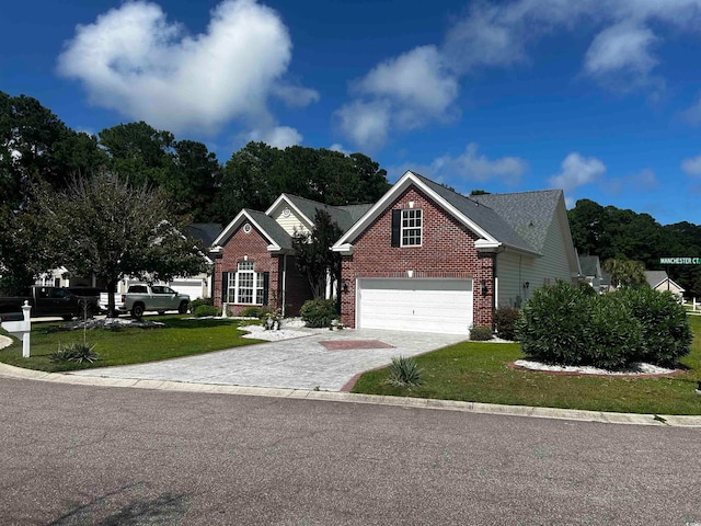 view of front of house featuring a garage and a front lawn