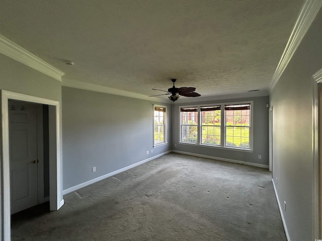 carpeted empty room with crown molding, a textured ceiling, baseboards, and ceiling fan