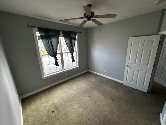 unfurnished bedroom with carpet floors, visible vents, and baseboards