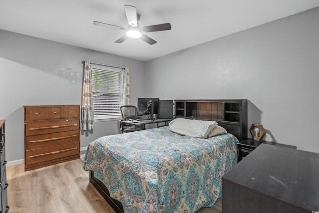 bedroom with ceiling fan and light wood-type flooring