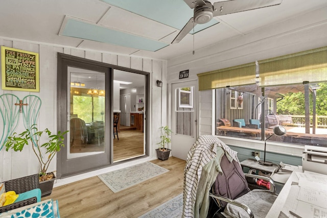 sunroom featuring ceiling fan and a healthy amount of sunlight