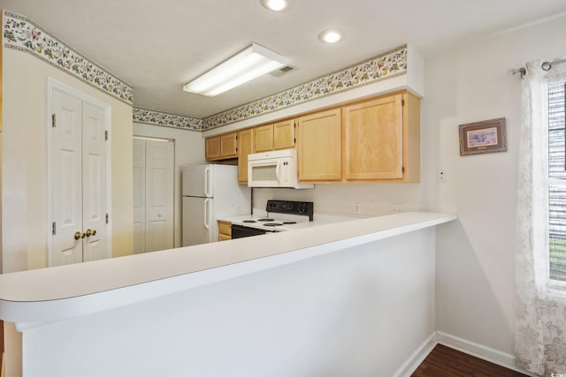 kitchen with dark hardwood / wood-style floors, light brown cabinets, white appliances, and kitchen peninsula