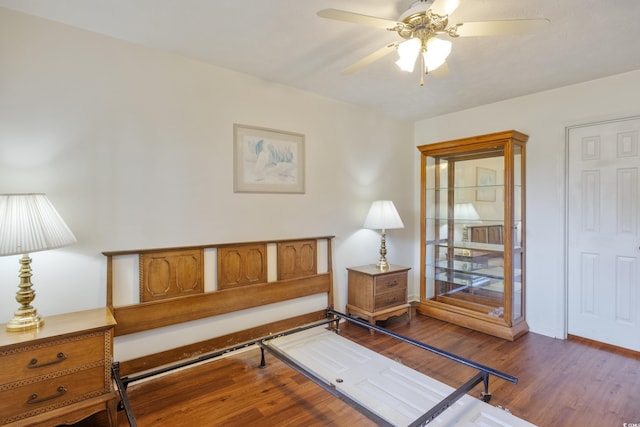 living area with hardwood / wood-style flooring and ceiling fan