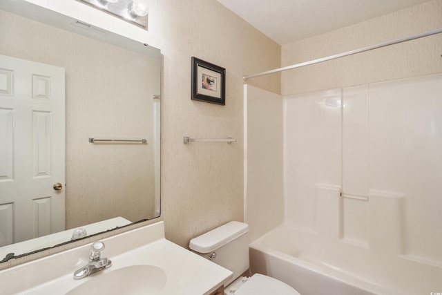 full bathroom with vanity,  shower combination, and toilet