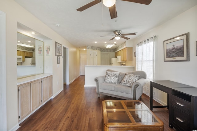 living room with dark hardwood / wood-style flooring and ceiling fan