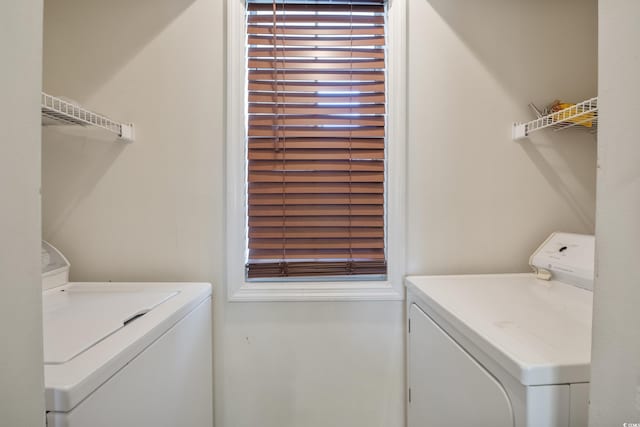 clothes washing area featuring washing machine and clothes dryer