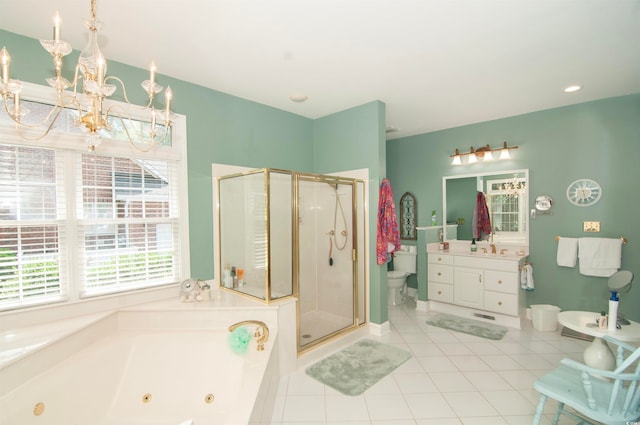 full bathroom with tile patterned floors, separate shower and tub, vanity, and toilet