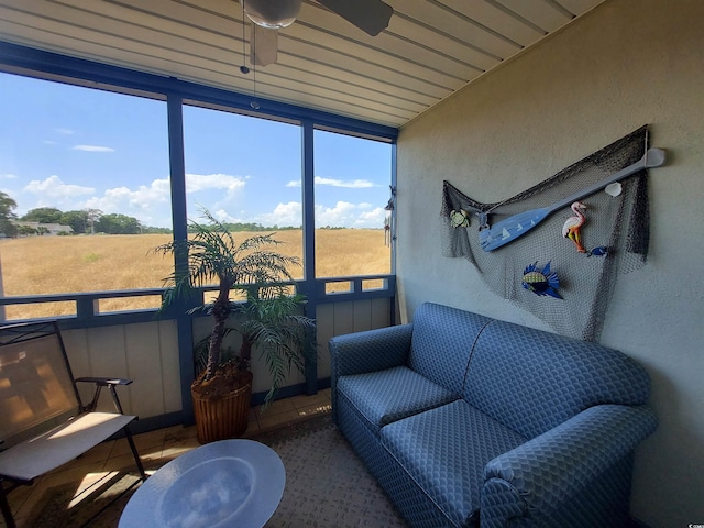 sunroom featuring plenty of natural light and ceiling fan