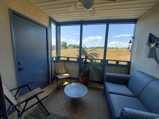 sunroom with plenty of natural light and ceiling fan