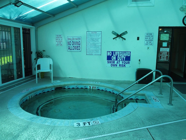 view of pool featuring an indoor hot tub