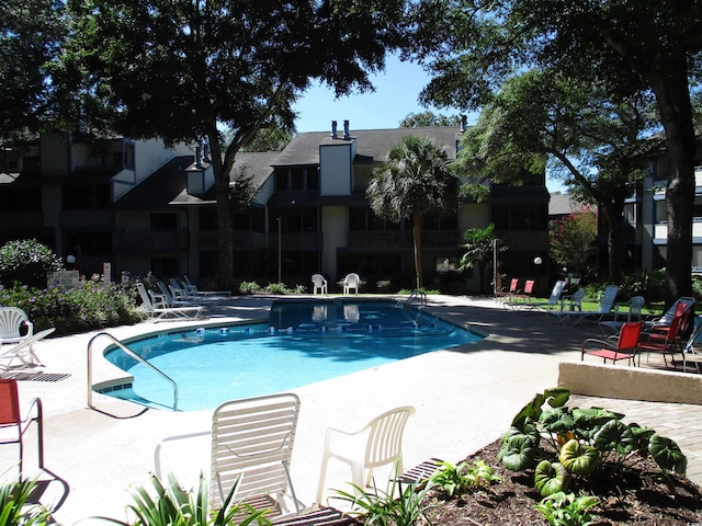 view of swimming pool with a patio area