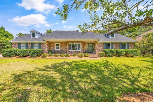 single story home featuring a front yard