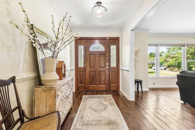 foyer entrance featuring crown molding and dark hardwood / wood-style floors