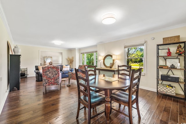 dining space featuring crown molding, a healthy amount of sunlight, and dark hardwood / wood-style floors