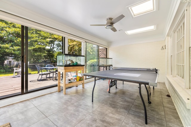 game room featuring ceiling fan and crown molding