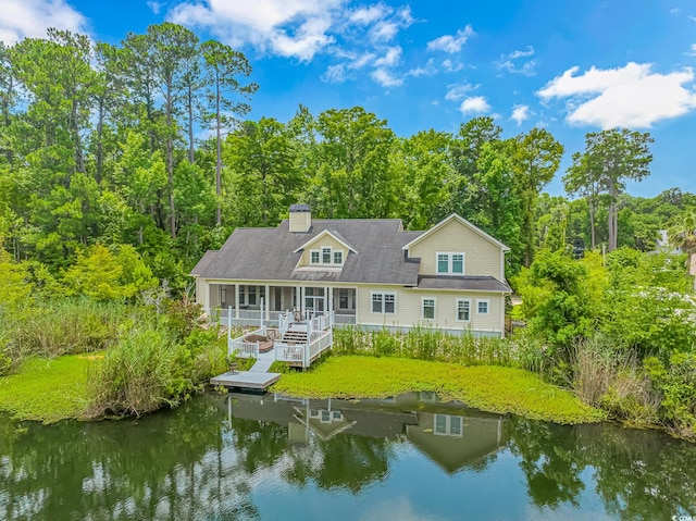 rear view of property featuring a water view