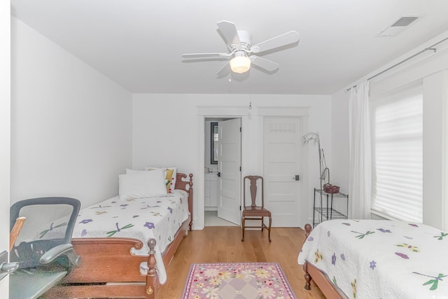 bedroom with ceiling fan and light hardwood / wood-style flooring