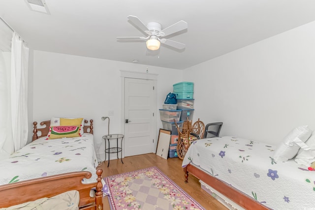 bedroom featuring ceiling fan and light wood-type flooring