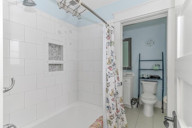 full bathroom with tile patterned floors, vanity, toilet, and shower / bath combination with curtain