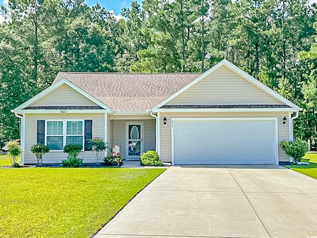 view of front facade featuring a front lawn, an attached garage, driveway, and roof with shingles