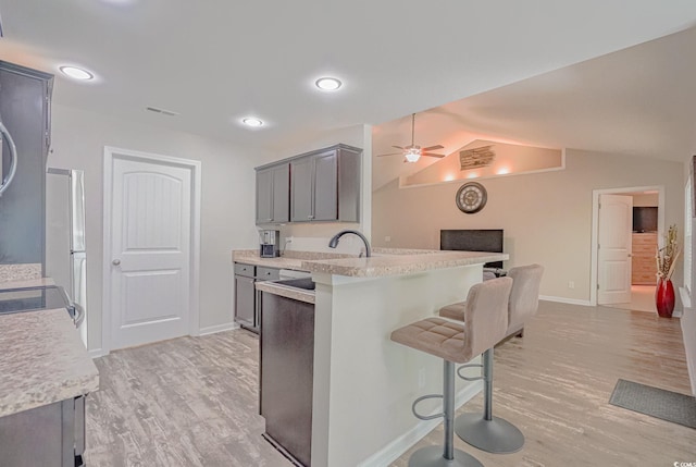 kitchen with hanging light fixtures, sink, a notable chandelier, appliances with stainless steel finishes, and dark brown cabinetry