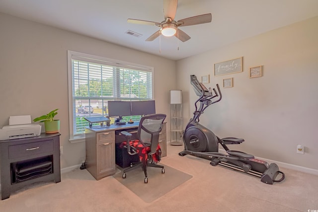 carpeted office featuring ceiling fan