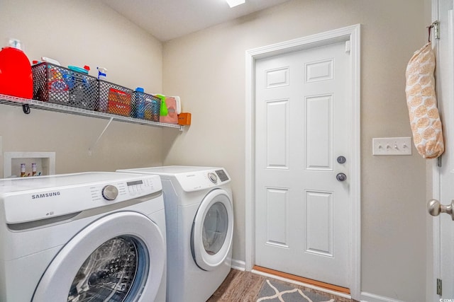 washroom with hardwood / wood-style floors and independent washer and dryer