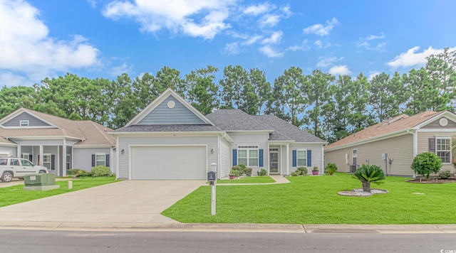 view of front facade with a garage and a front lawn