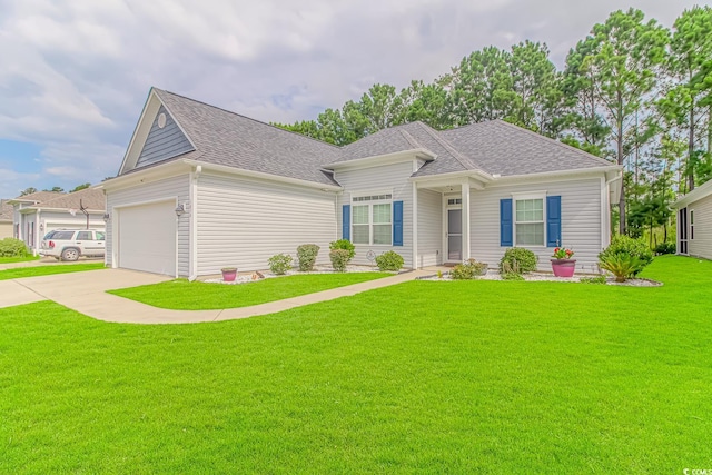 view of front of house with a garage and a front yard