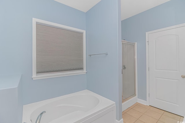 bathroom with tile patterned flooring and independent shower and bath