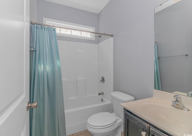 full bathroom featuring toilet, shower / bath combination with curtain, and vanity