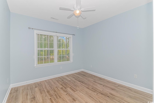 empty room with light wood-type flooring and ceiling fan