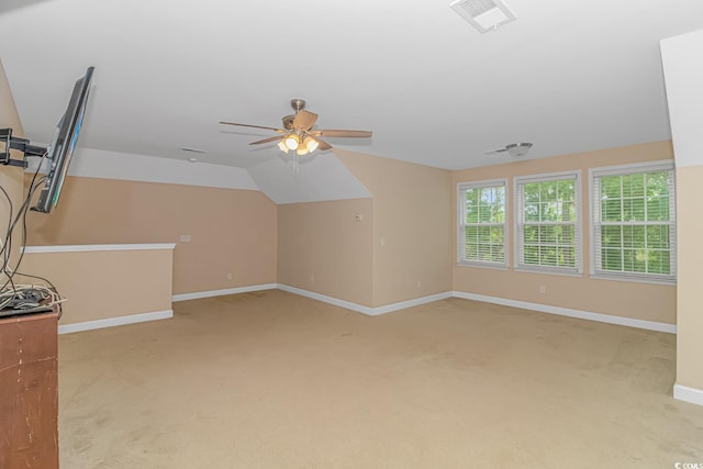 bonus room featuring vaulted ceiling, light colored carpet, and ceiling fan