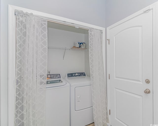 laundry area with independent washer and dryer