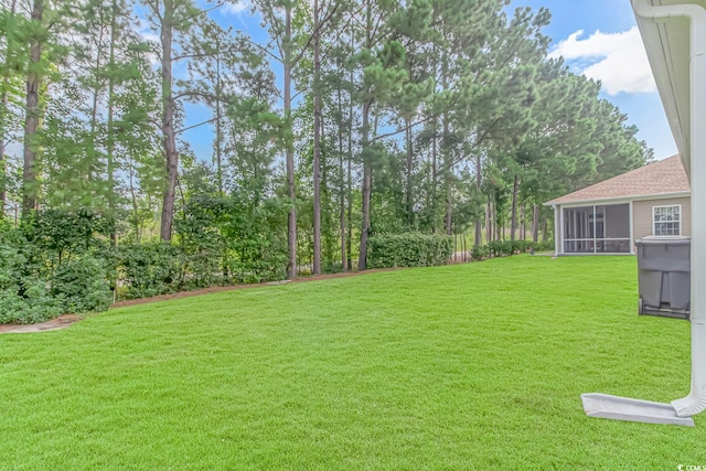 view of yard with a sunroom