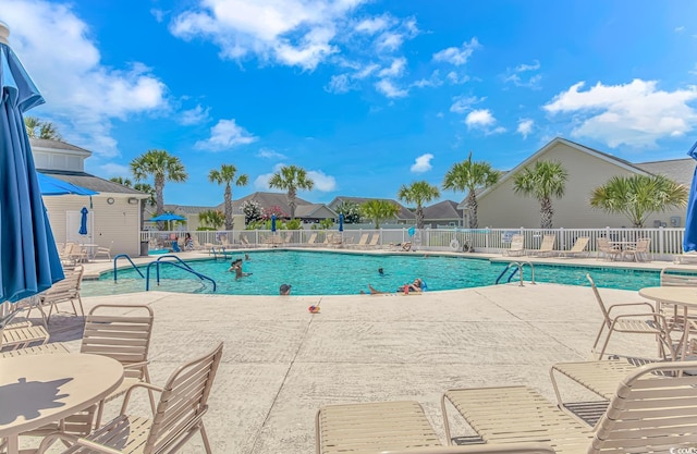 view of swimming pool with a patio