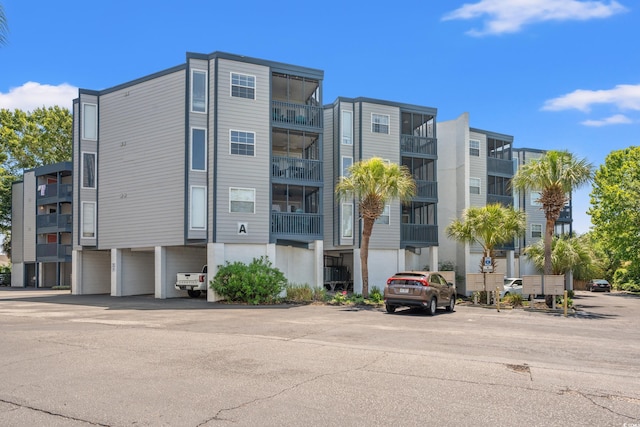 view of property with uncovered parking