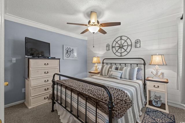 carpeted bedroom featuring baseboards, a ceiling fan, and a textured ceiling