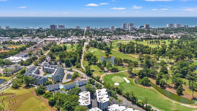 aerial view featuring view of golf course, a water view, and a city view