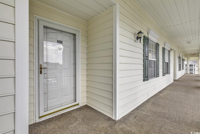 doorway to property with covered porch