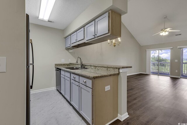 kitchen with light hardwood / wood-style flooring, sink, lofted ceiling, dishwasher, and ceiling fan