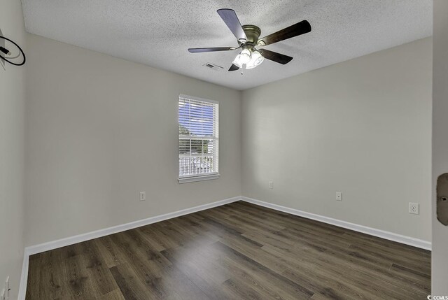 empty room featuring hardwood / wood-style flooring, a textured ceiling, and ceiling fan