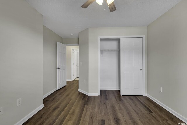 unfurnished bedroom featuring a closet, wood-type flooring, and ceiling fan