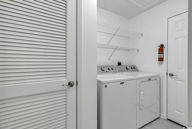 laundry room featuring independent washer and dryer