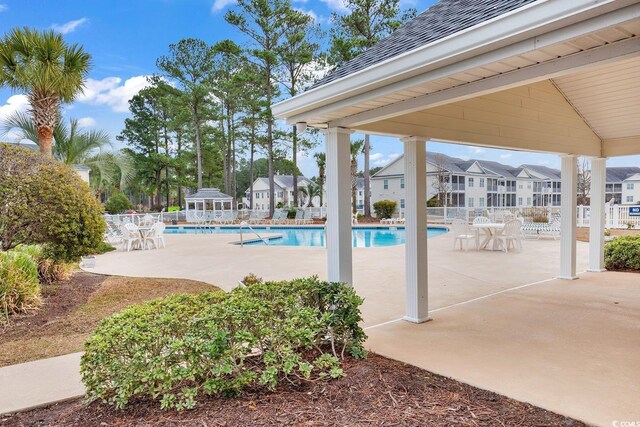 view of swimming pool with a patio area and a gazebo