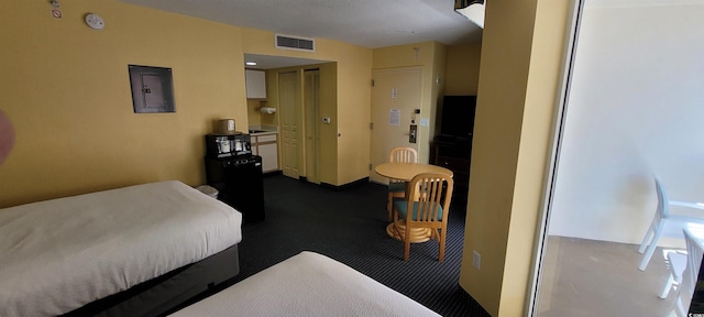 bedroom featuring electric panel