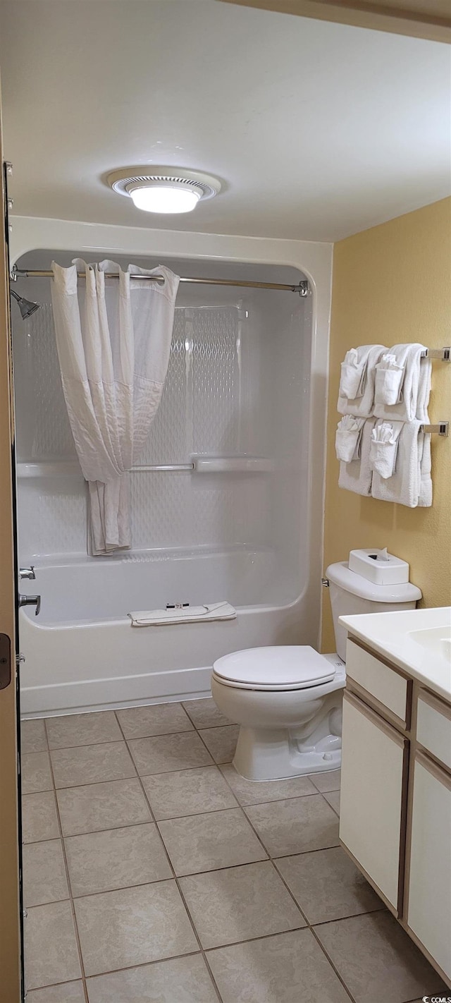 full bathroom with vanity, tile patterned flooring, toilet, and washtub / shower combination