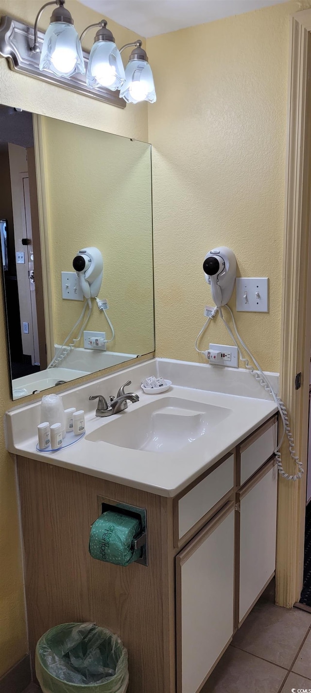 2701 S Ocean Blvd Unit 1410, North Myrtle Beach, SC 29582 - bathroom featuring vanity, tile patterned floors, and a textured wall