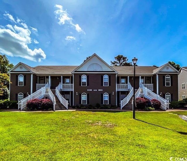 view of property featuring a front yard